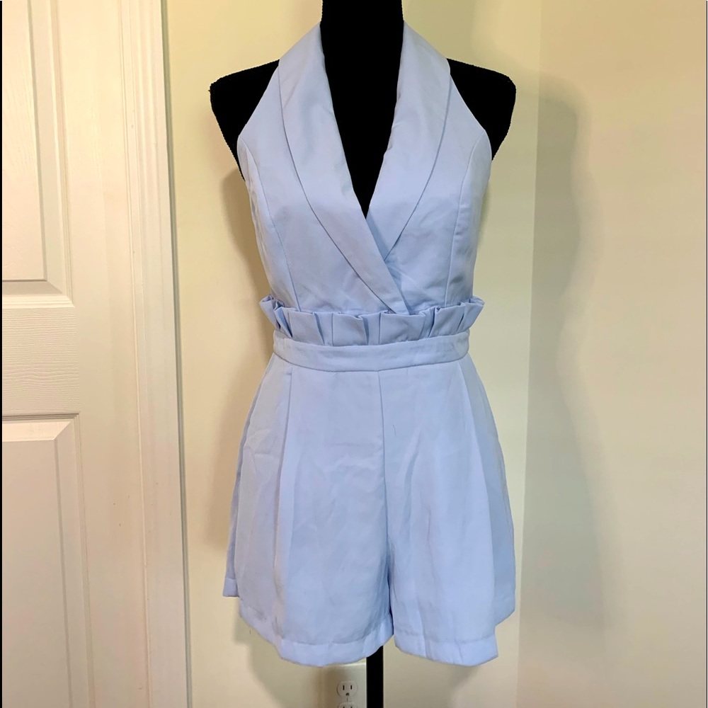 Halter top romper with ruffle detail at waist- light blue almost a purple shade